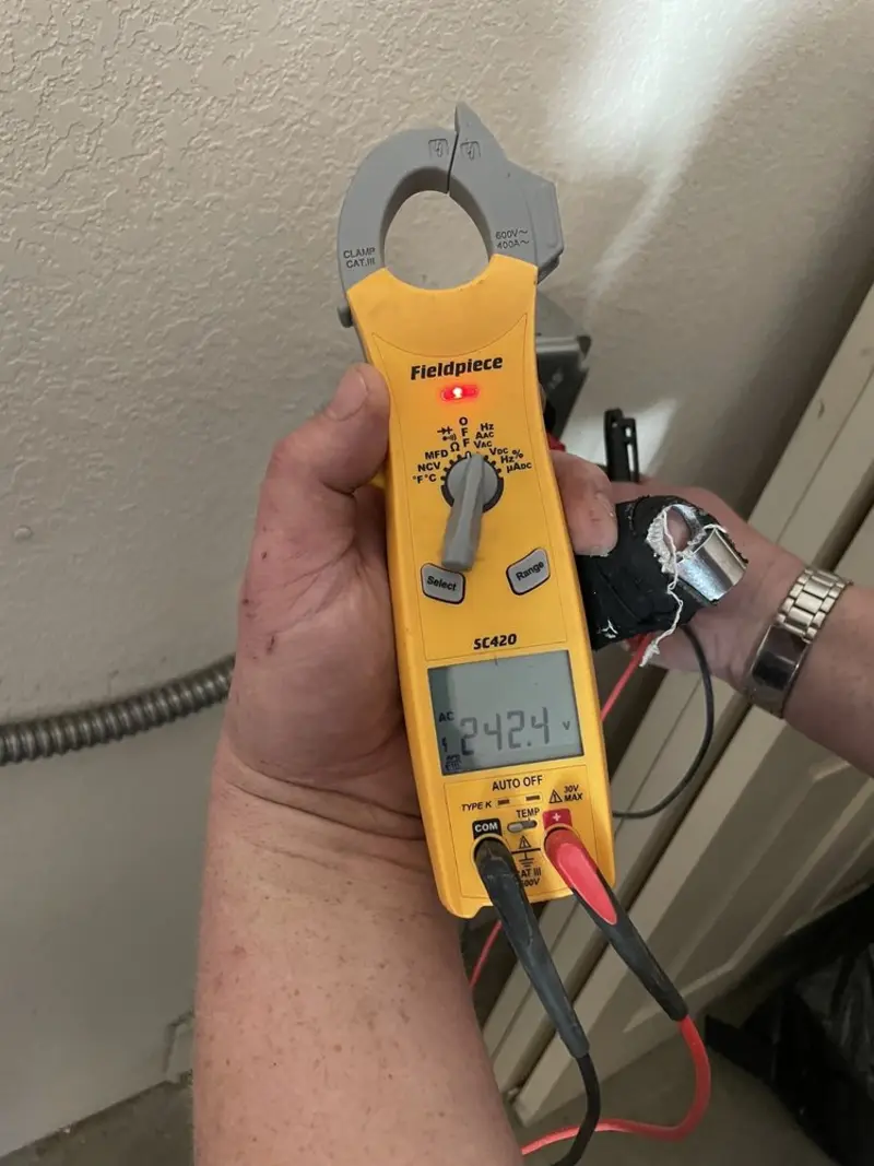 Voltage testing with clamp meter during Circuit Breaker Repair in Waupun
